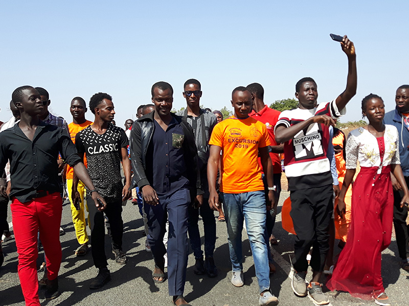 Students walking on the highway